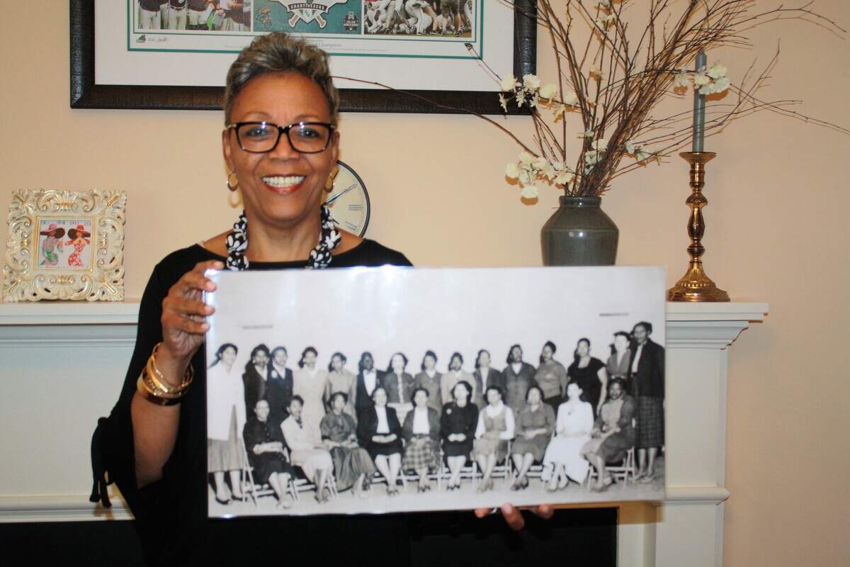 Conway Mayor Barbara Blain-Bellamy holds a photo from a 1950s class at Whittemore Elementary School.