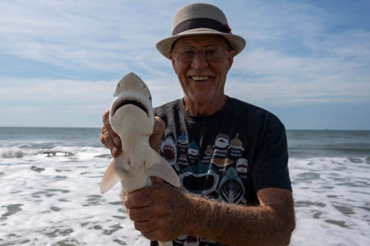 Mike Stranak returns from the surf with a small shark at a surf fishing clinic held by SCDNR. There are 17 species of sharks fishers can catch in South Carolina.