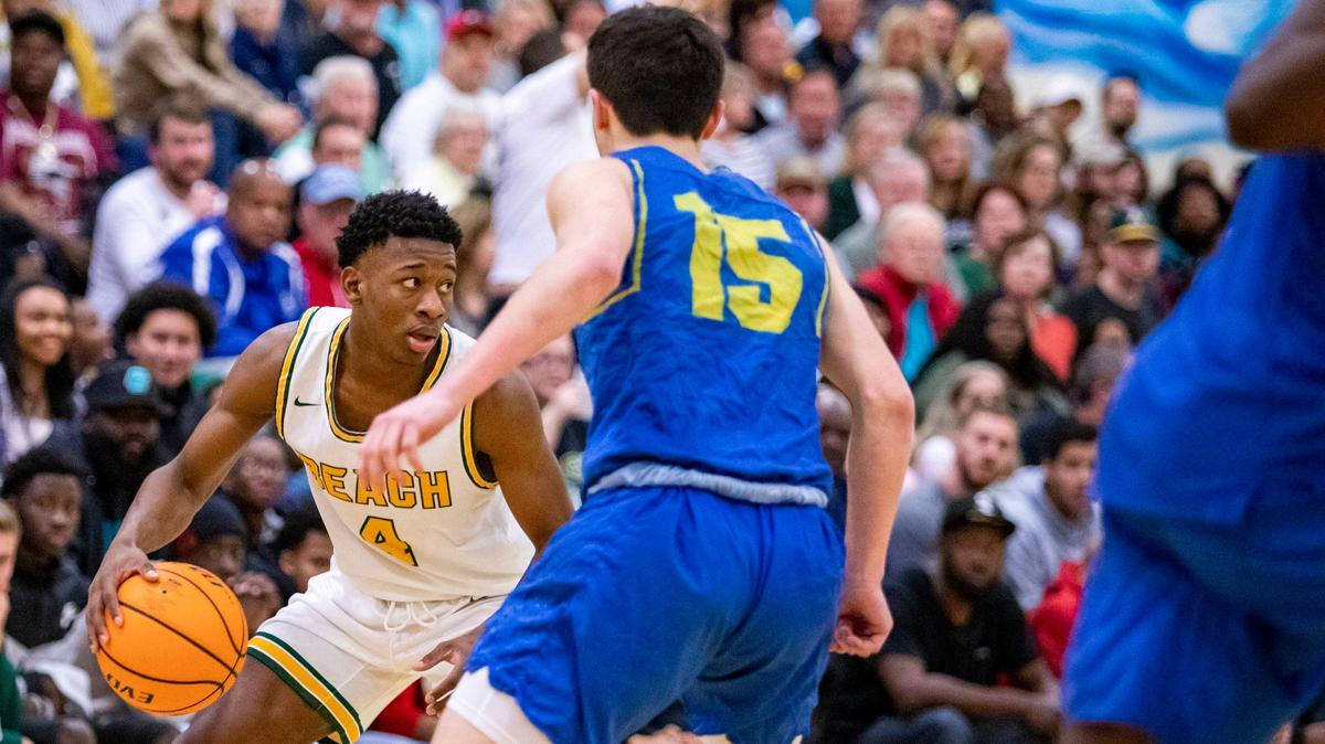 Myrtle Beach’s Emorie Knox looks ot pass as North Myrtle Beach guard Chad Beasley defends during the Seahawks’ Tuesday night matchup against North Myrtle Beach at Myrtle Beach High School.