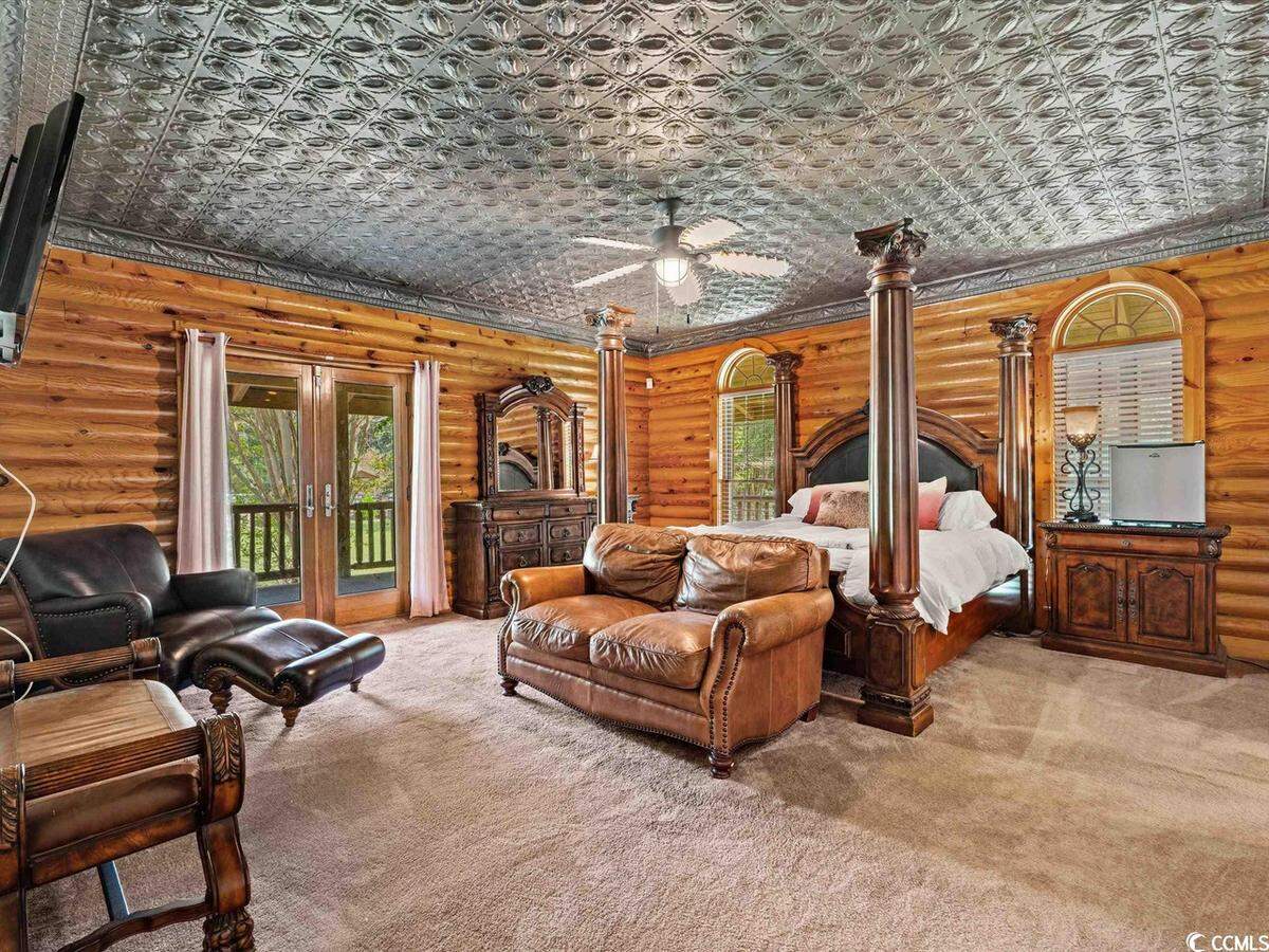 What can be considered the master suite or the main bedroom. It is the biggest and has an en suite bathroom with a jacuzzi tub. There is also a patio located directly outside the bedroom that guests can access.