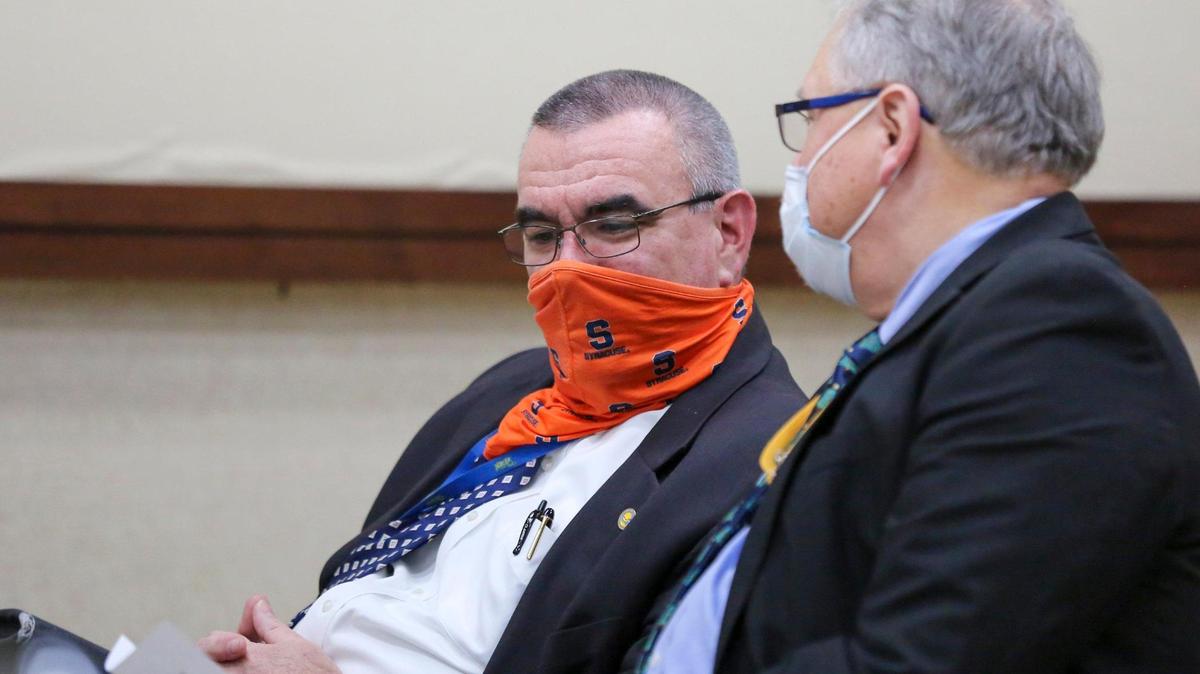 City Manager John Pedersen (left) talks with Deputy City Manager Jonathan “Fox” Simons during a special city council meeting in which the council ultimately decided to enter into negotiations with Simons for the job of City Manager when Pedersen retires this year. December 17, 2020.