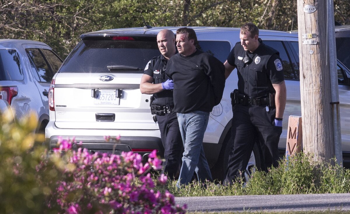 Police were in an 8 hour standoff at the Conway Country Club on Monday when a man later identified as Christopher Lloyd Ross barricaded himself inside the clubhouse. A team of officers entered and brought the man out in handcuffs late Monday afternoon. There were no reports of injuries in the incident. March 26, 2018.