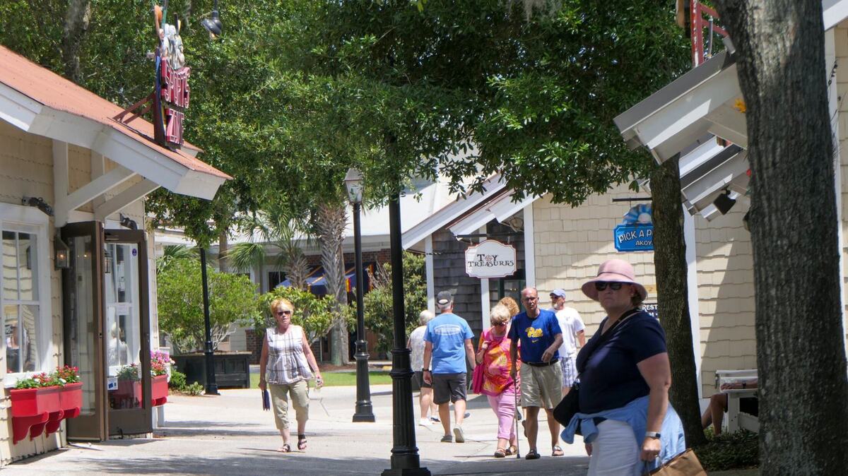 Shoppers stroll through the Barefoot Landing shopping and entertainment district in North Myrtle Beach, S.C. File photo from 2024.