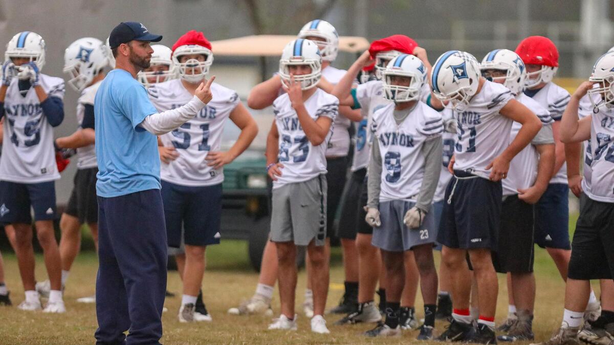 Aynor football coach Jason Allen gives instructions during practice Monday afternoon at Aynor High School.