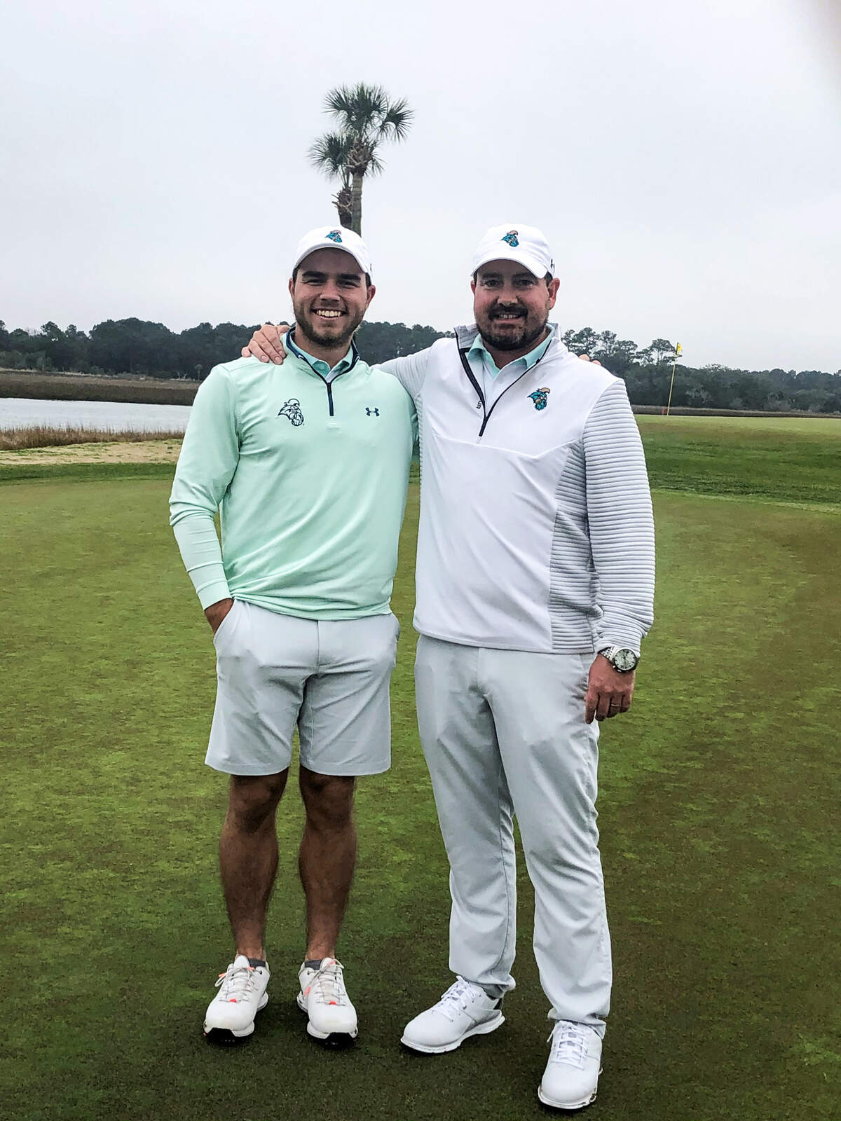 Coastal Carolina’s States Fort poses with Chanticleers men’s golf coach Jim Garren after he won the Any Given Tuesday (AGT) Intercollegiate held at Oak Point Golf Club on Kiawah Island.