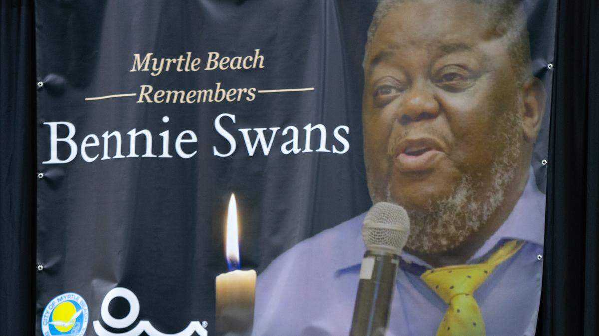 A poster memorializing Bennie Swans hung over the stage at his “Celebration of Life” ceremony.
