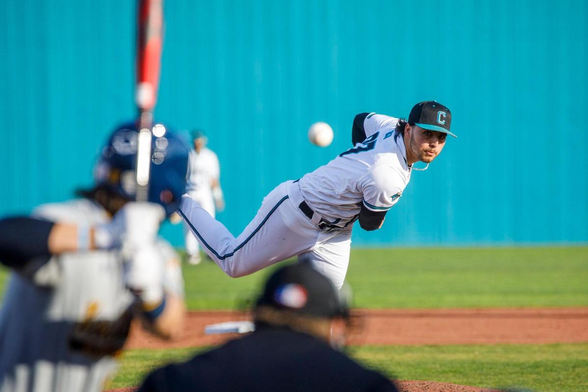 Coastal Carolina’s Nick Parker throws a pitch against Kent State during the Baseball at the Beach Tournament at Spring Brooks Stadium in Conway on Friday afternoon. February 18, 2022.