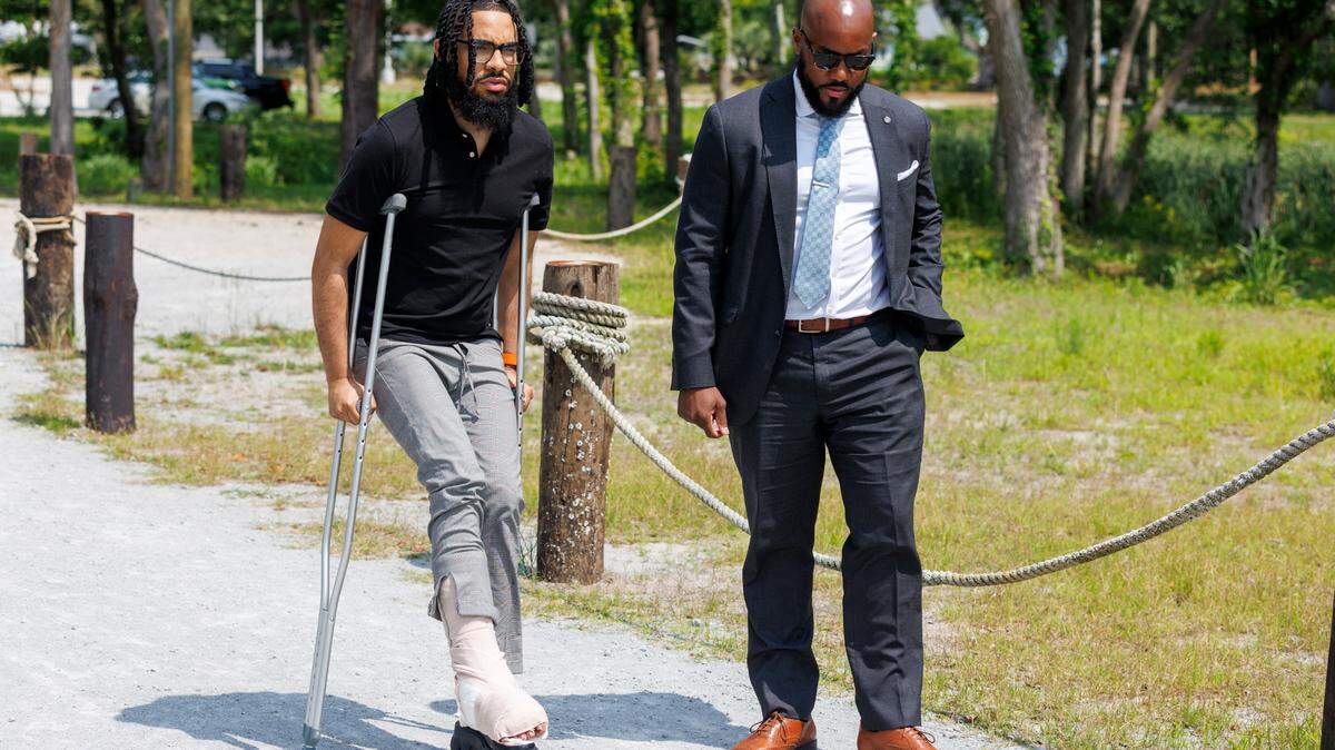 Jeremy Evans and his lawyer, Tyler Bailey, hold a press conference to speak about the mass shooting at the docks off Watson Avenue where the incident took place. Evans was one of ten people who were shot after a party boat returned to the docks on night of May 25, 2024. Wednesday, June 4, 2025.