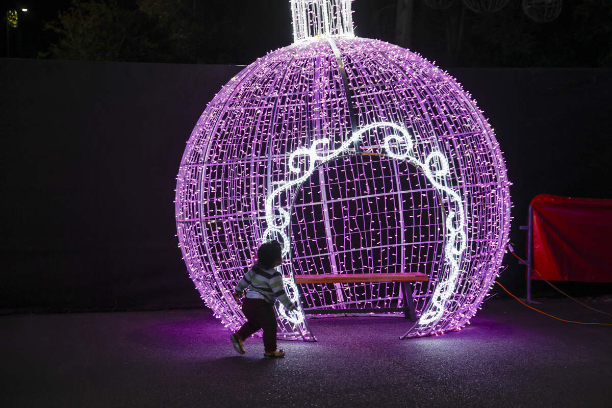 A child plays in Santa’s Village on Thursday night as final preparations are being made for North Myrtle Beach’s largest light show at the North Myrtle Beach Park and Sports Complex. The event opens November 24, 2025.