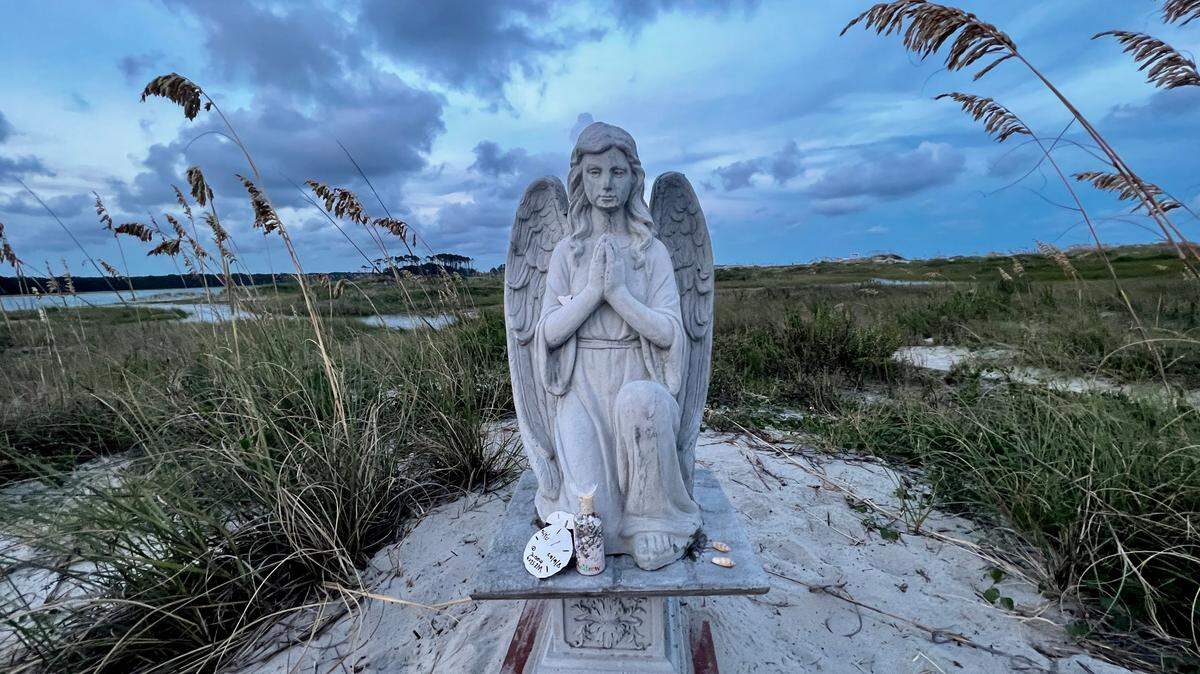 An angel statue in the dunes at Cherry Grove Point in North Myrtle Beach, S.C. went missing last year but has been replaced this week prior to the impacts of Hurricane Idalia on the South Carolina coast. Aug. 29, 2023.