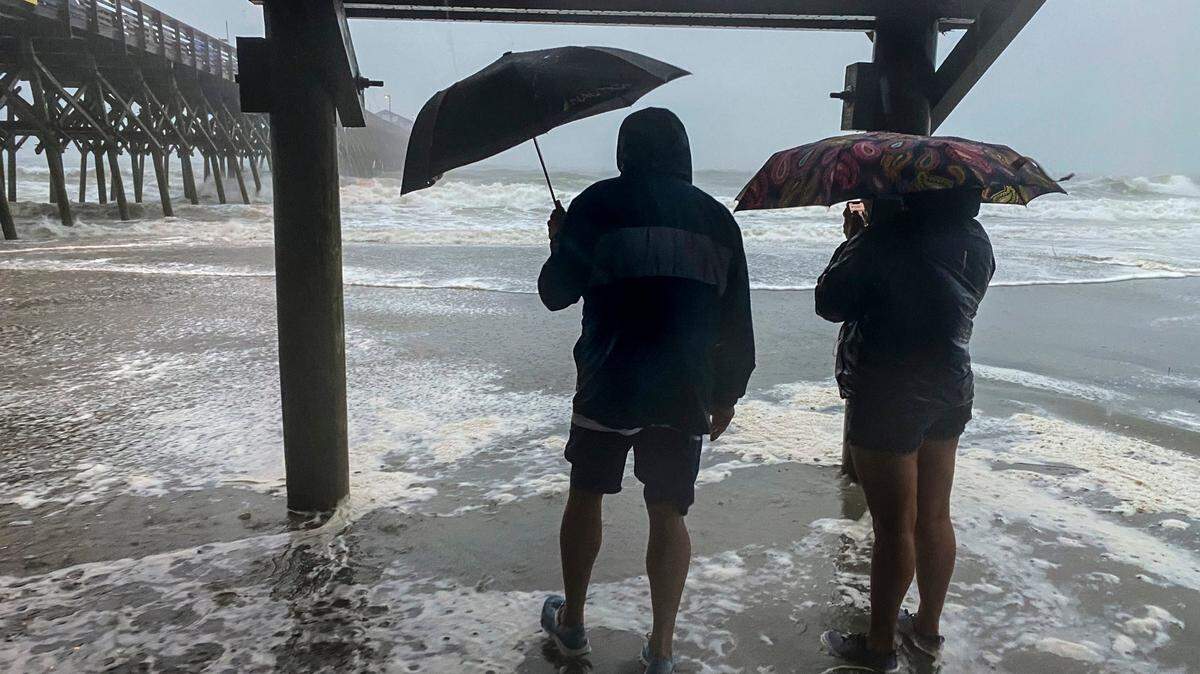 Local and tourists ventured to the Garden City Pier to watch the arrival of Tropical Storm Isaias on August 3, 2020.