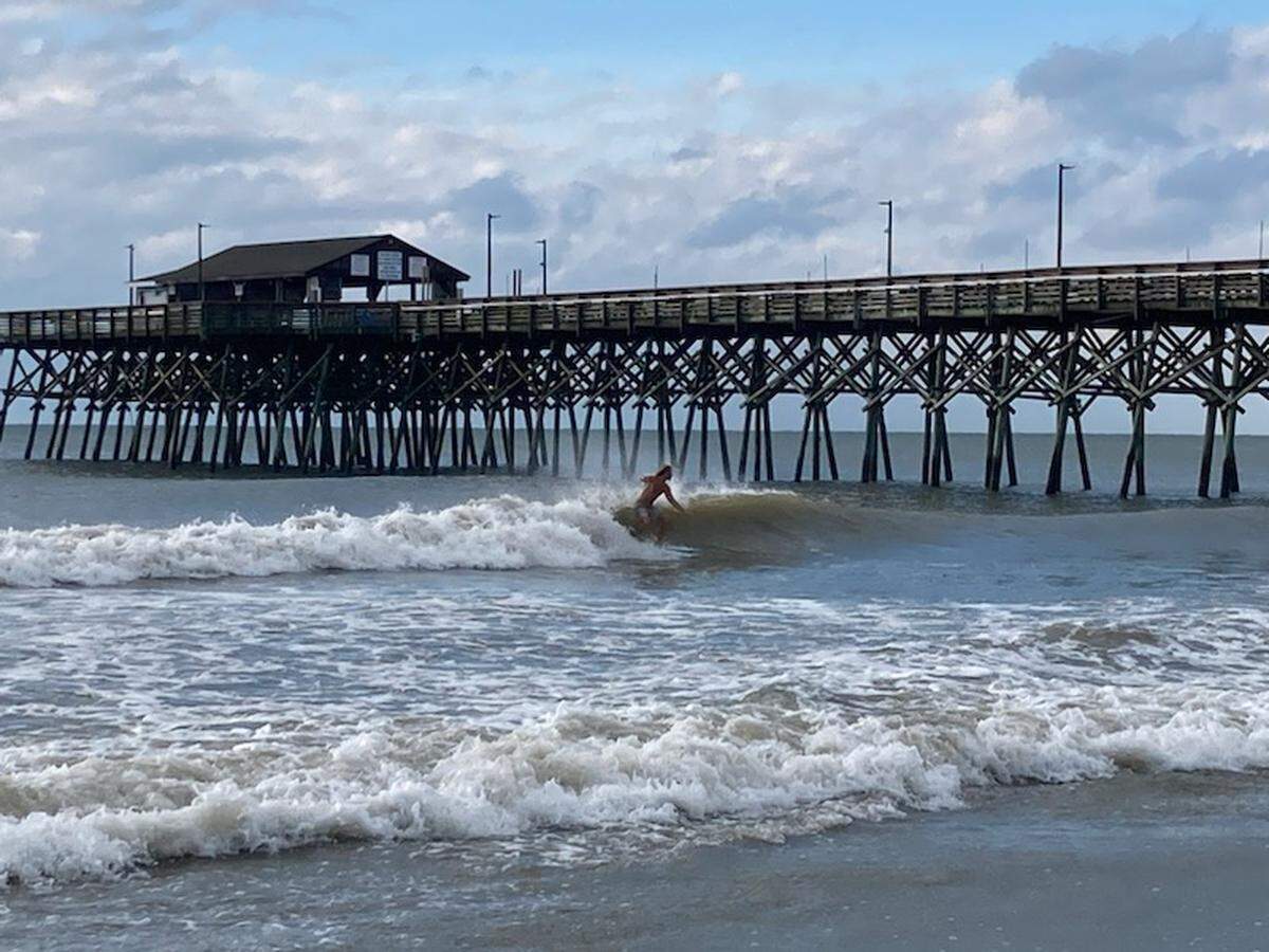 Some surfers were taking advantage of the waves left behind by Tropical Storm Idalia early Thursday Aug. 31 near The Pier at Garden City.