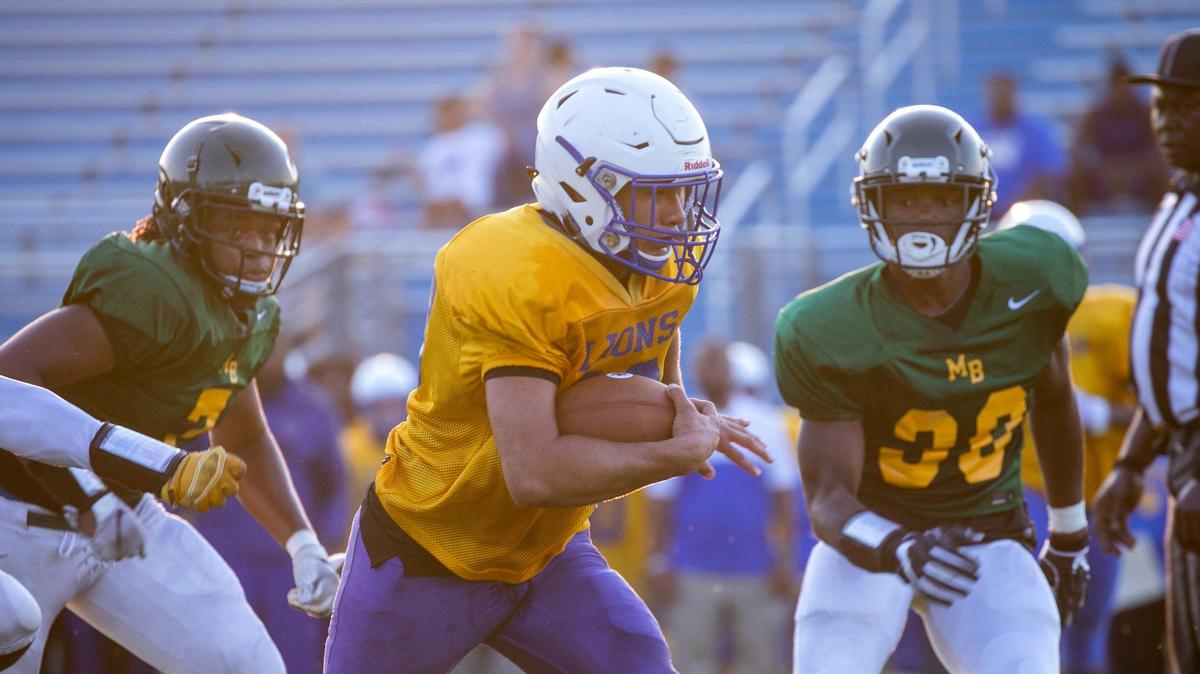 Loris’ Wayne Herring runs against Myrtle Beach. Loris High School hosted Myrtle Beach in a pre-season scrimmage game on Thursday night.