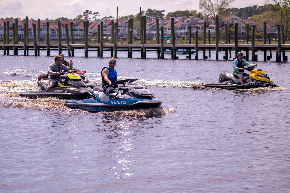 Jet ski riders pass the docks of Little River on the Intracoastal Waterway on Friday. South Carolina Governor Henry McMaster closed public boat landings on March 30th, but reopened them today allowing residents back onto public waterways while following social distancing orders. April 17, 2020