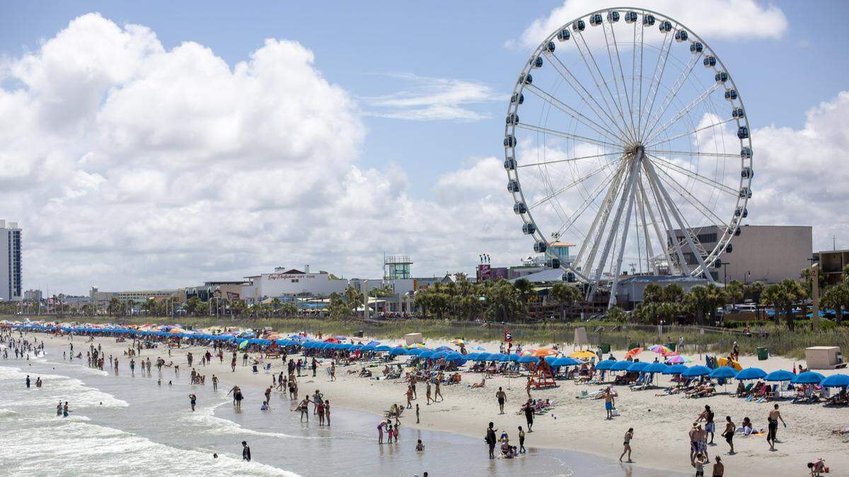 A view of the beach and SkyWheel looking south from Pier 14 in Myrtle Beach on July 4.