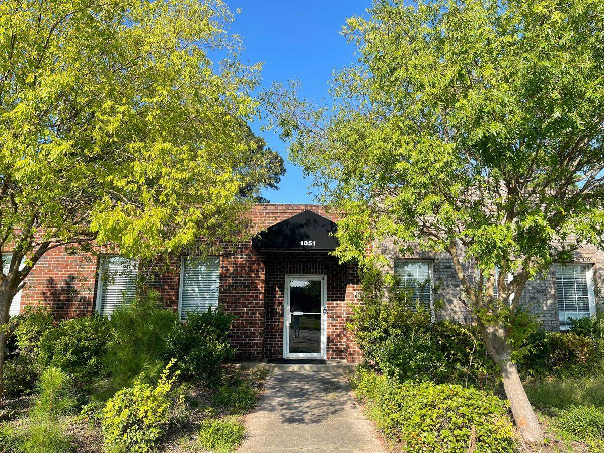 The front door of 1051 Shine Avenue in Market Common on Thursday, Aug. 29, 2024. This building has been declared abandoned by local officials and one day might be home to indoor pickleball courts. 