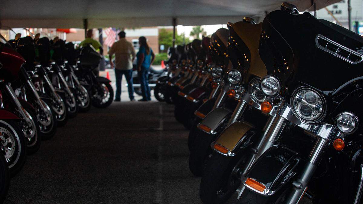Motorcycles sit parked underneath a tent at Harley Davidson in North Myrtle Beach Saturday as rain begins to come down. The 2018 Fall Bike Rally begins October 1 in Myrtle Beach.