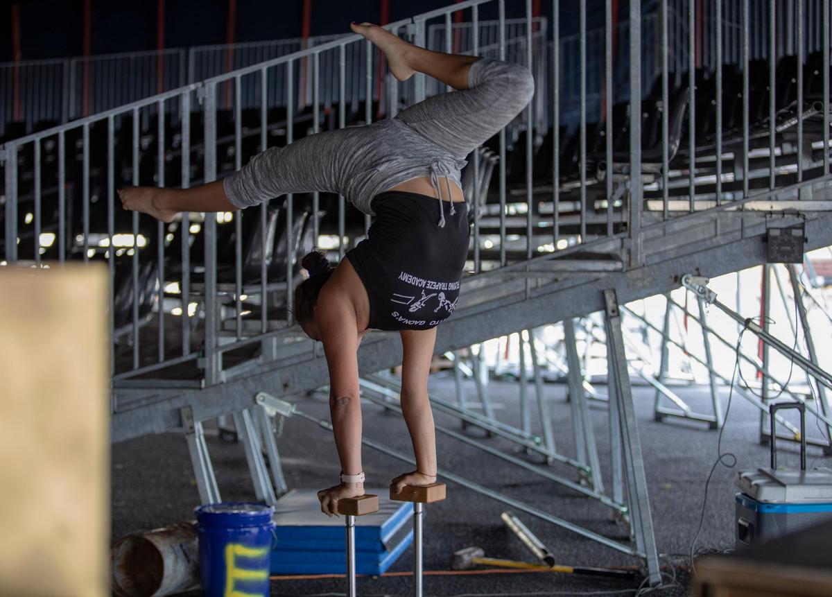 Noemi España, a contortionist with Le Grand Cirque from Sarasota Fla., stretches inside a tent at the Waccamaw Center at Fantasy Harbour in Myrtle Beach. Le Grand Cirque, which previously operated out of the now-demolished Palace Theatre, will perform eight shows a week throughout the summer.