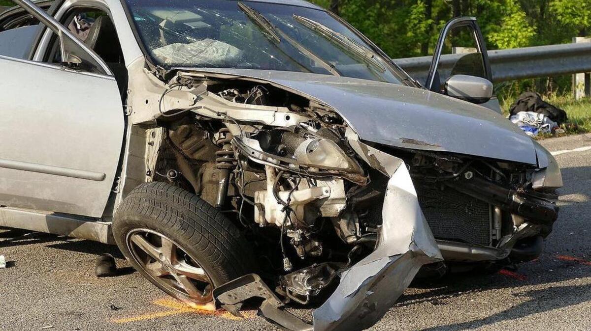 A crumpled Honda, a debris field of clothes and a mangled guard rail are left on S.C. 22 on Tuesday, May 16, 2017. The state highway patrol reported the accident happened around 2:20 p.m. at mile marker 10.