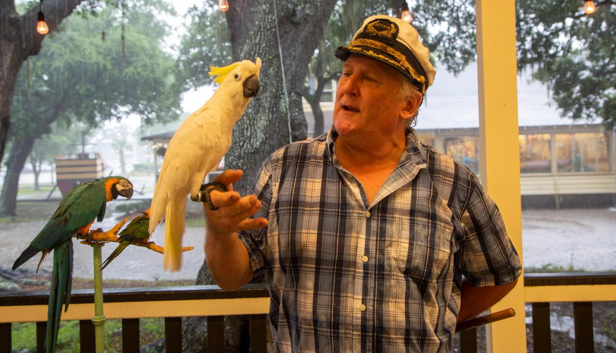 Joe Weeks, the “Birdman” of Murrells Inlet, poses with Rocky, his pet Parakeet at the Lazy Gator in Murrells Inlet on July 20.