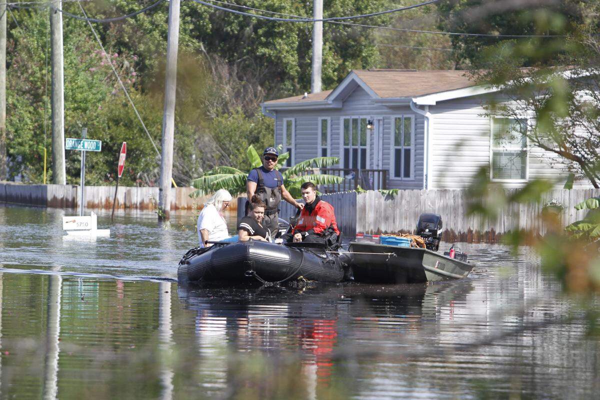 The Coast Guard assists residents of the Rosewood Estates neighborhood in Socastee. Sept. 24, 2018