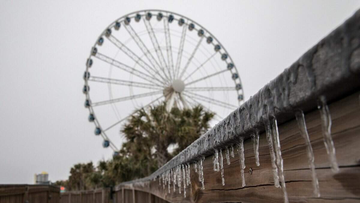 Ice coats the boardwalk in Myrtle Beach. Forecasters expect Winter Storm Grayson to drop up to four inches of snow and ice on the Grand Strand area on Wednesday evening. Jan. 3, 2018.