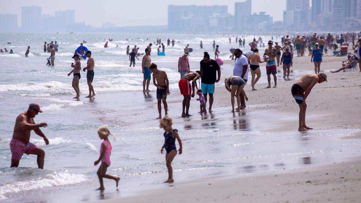 A summer haze blankets beach crowds in North Myrtle Beach, S.C. June 9, 2023.