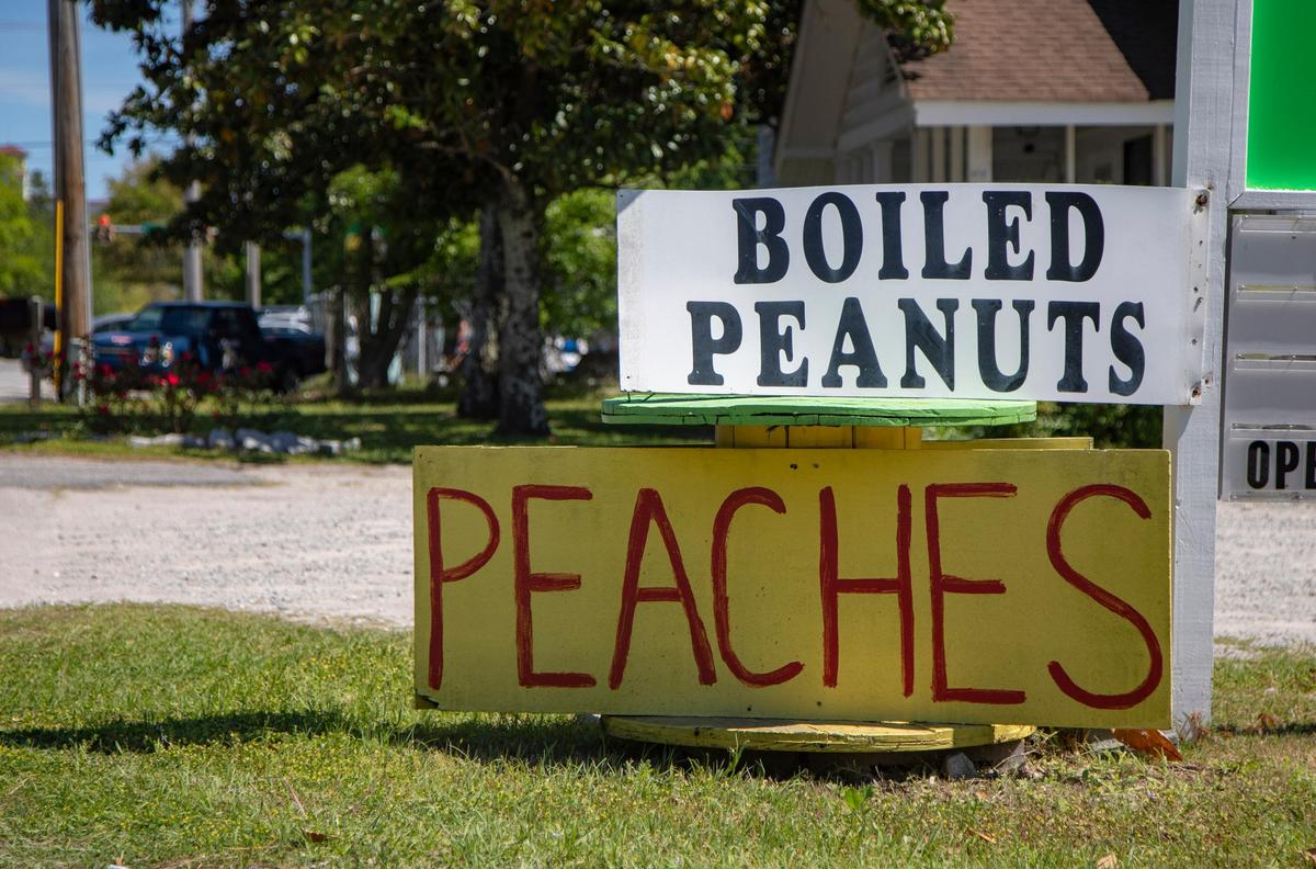 A sign advertises boiled peanuts and peaches outside of Myrtle Beach Produce on 29th Avenue North in Myrtle Beach.