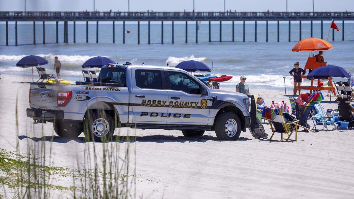 Horry County Police block off a section of the beach as South Carolina State Troopers investigated the the scene of an incident on June 13, 2024, near the Nash Street beach access. A female sunbather was killed after being struck by an Horry County Police vehicle. June 14, 2024.