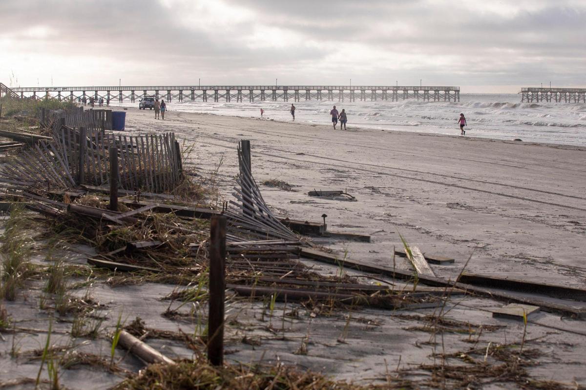 A storm surge from Hurricane Isaias combined with king tides damaged caused damage to the dunes in North Myrtle Beach and collapsed a section of the Sea Cabins Pier on Tuesday. August 4, 2020.