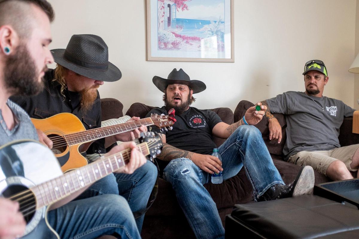 Members of the Whits End band warm up in Surfside Beach the morning before their first performance at Carolina Country Music Fest. The Whits End band, from Lancaster County S.C., won the opportunity to perform at Carolina Country Music Fest buy winning four rounds of Battle of the Bands in Charlotte, N.C.