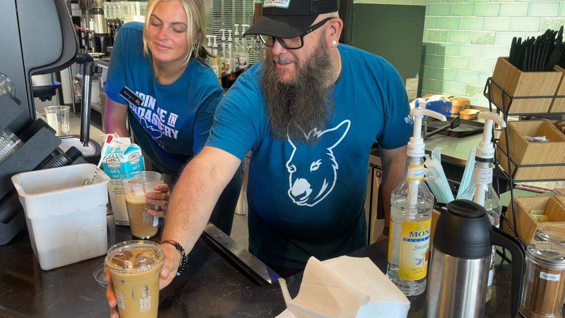 Bad Ass Coffee of Hawaii manager Ron “Crash” Kissell serves an iced coffee at a Surfside Beach location. The shop uses coffee ice cubes in its drinks to prevent them from becoming watered down. A new location is coming to Rock Hill.