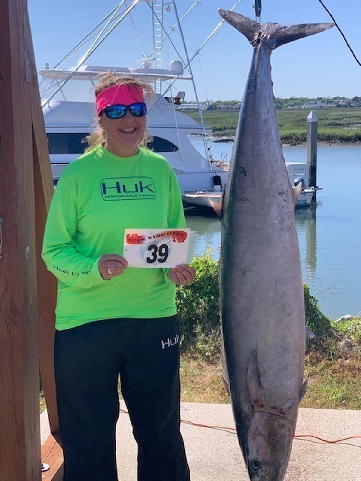 Tamesha Beck shows off the 98.3-pound wahoo she caught along with her husband Morris Beck aboard Exception in the 2020 S.C. Wahoo Series.