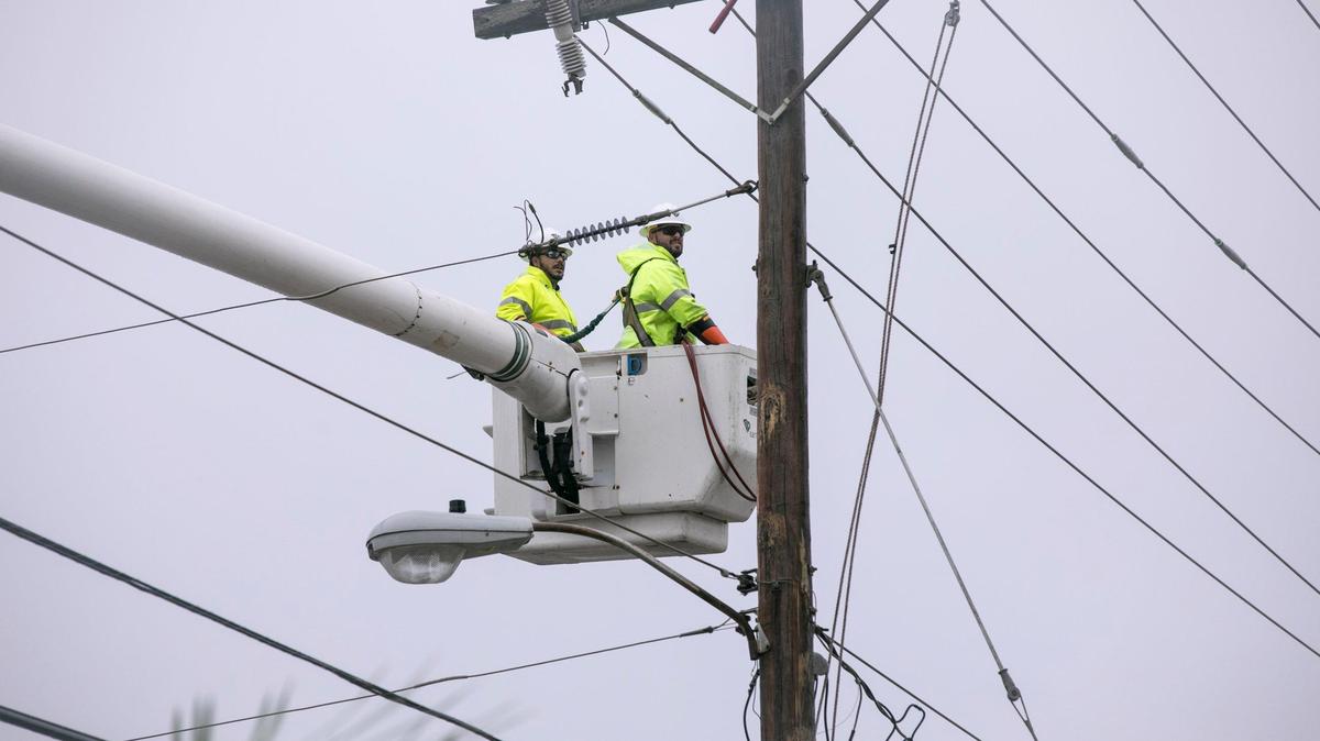Power crews from Santee Cooper work on lines in the Cherry Grove community as Tropical Storm Florence looms over North Myrtle Beach. Saturday, September 15, 2018.