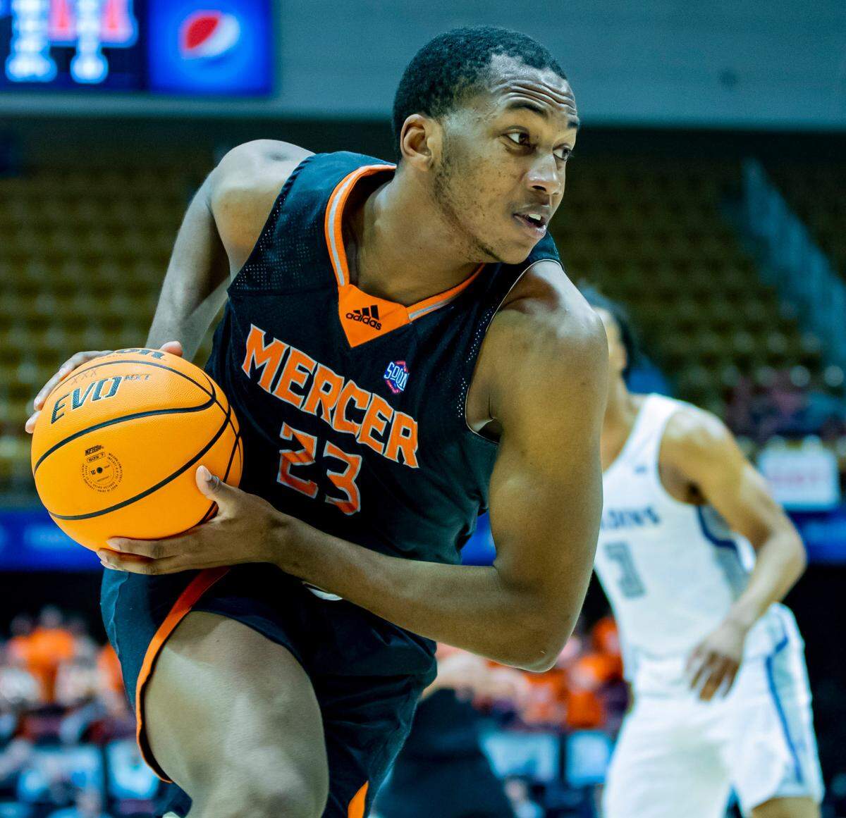 Mercer junior forward James Glisson III drives to the net against Furman Saturday afternoon in the SoCon Ingles Basketball Championships at the Harrah’s Cherokee Center in Asheville, N.C.