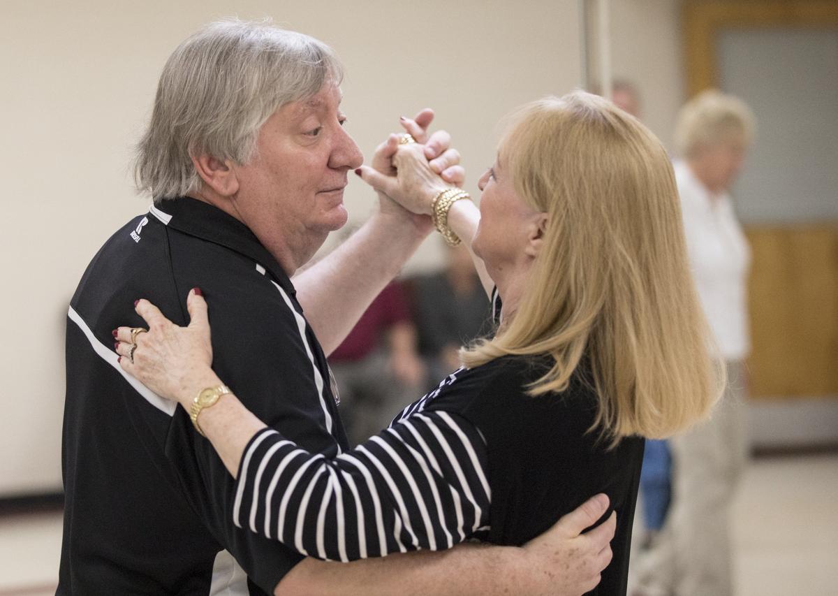 Joe DeFeo ballroom dances with his fiancee, Sandra Lucas-Hyde. The Horry County school board chair also teaches firearms classes, and helps teach ballroom dancing on Wednesday nights. DeFeo is also a helicopter pilot, state constable, and karaoke D.J. in his spare time.