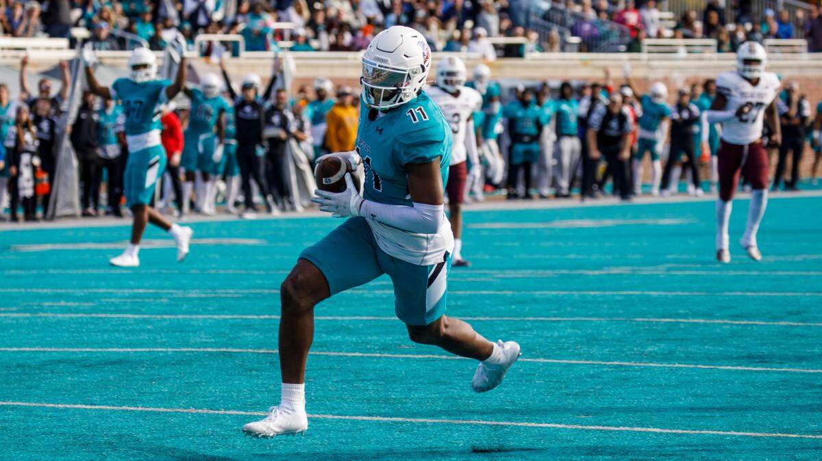 Coastal Carolina receiver Kameron Brown catches a long pass from Grayson McCall to score a touchdown against Texas State on Saturday in a Sun Belt Conference NCAA FBS college football game in Conway SC. Nov. 20, 2021.