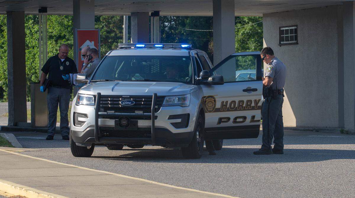 Horry County police officers investigate the scene at a BB&T bank off of Highway 17 in Little River after an attempted robbery on Tuesday.