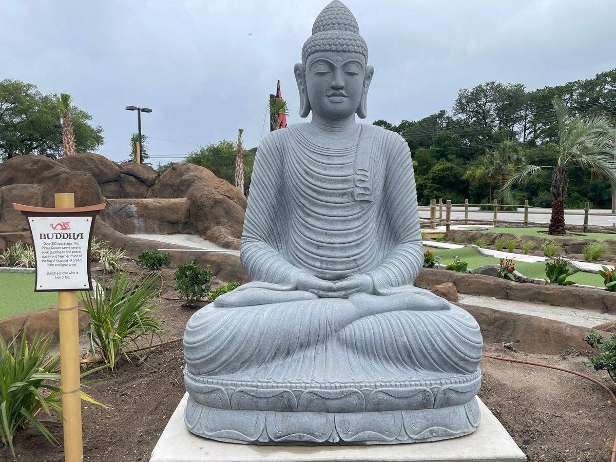 The mini golf course features several decorations sourced from Asia, including a Buddha statue carved from an eight thousand-pound stone. June 22.