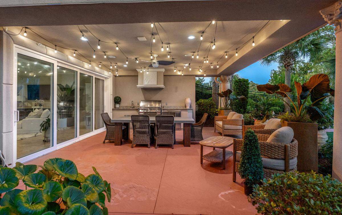 With a covered grill area in the backyard, cooking isn’t confined to the kitchen.