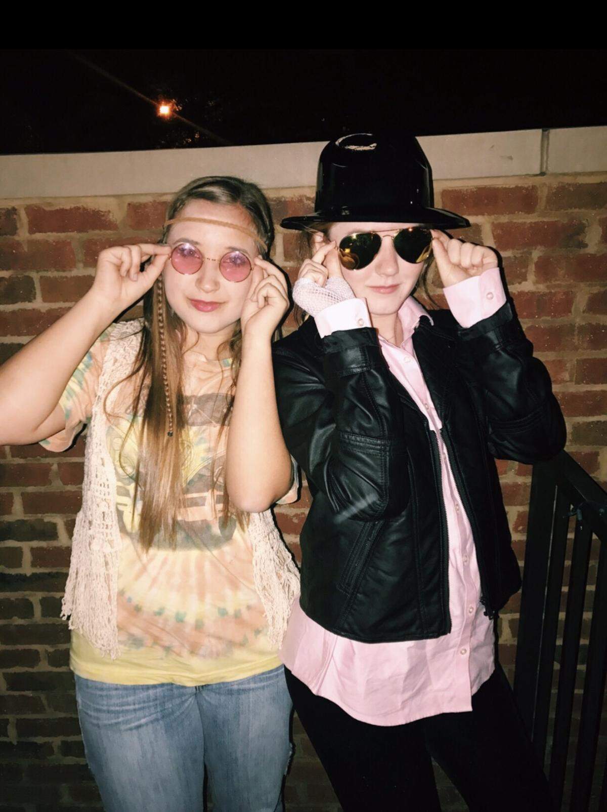 Shelby Beckler, left, and Rachel Mullen pose for a Halloween photo.