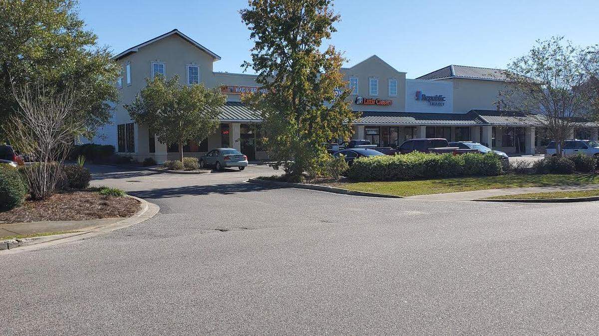 A parking lot at a Conway shopping complex sits quiet on Nov. 23. A 30-year-old was shot and killed in the lot hours earlier.