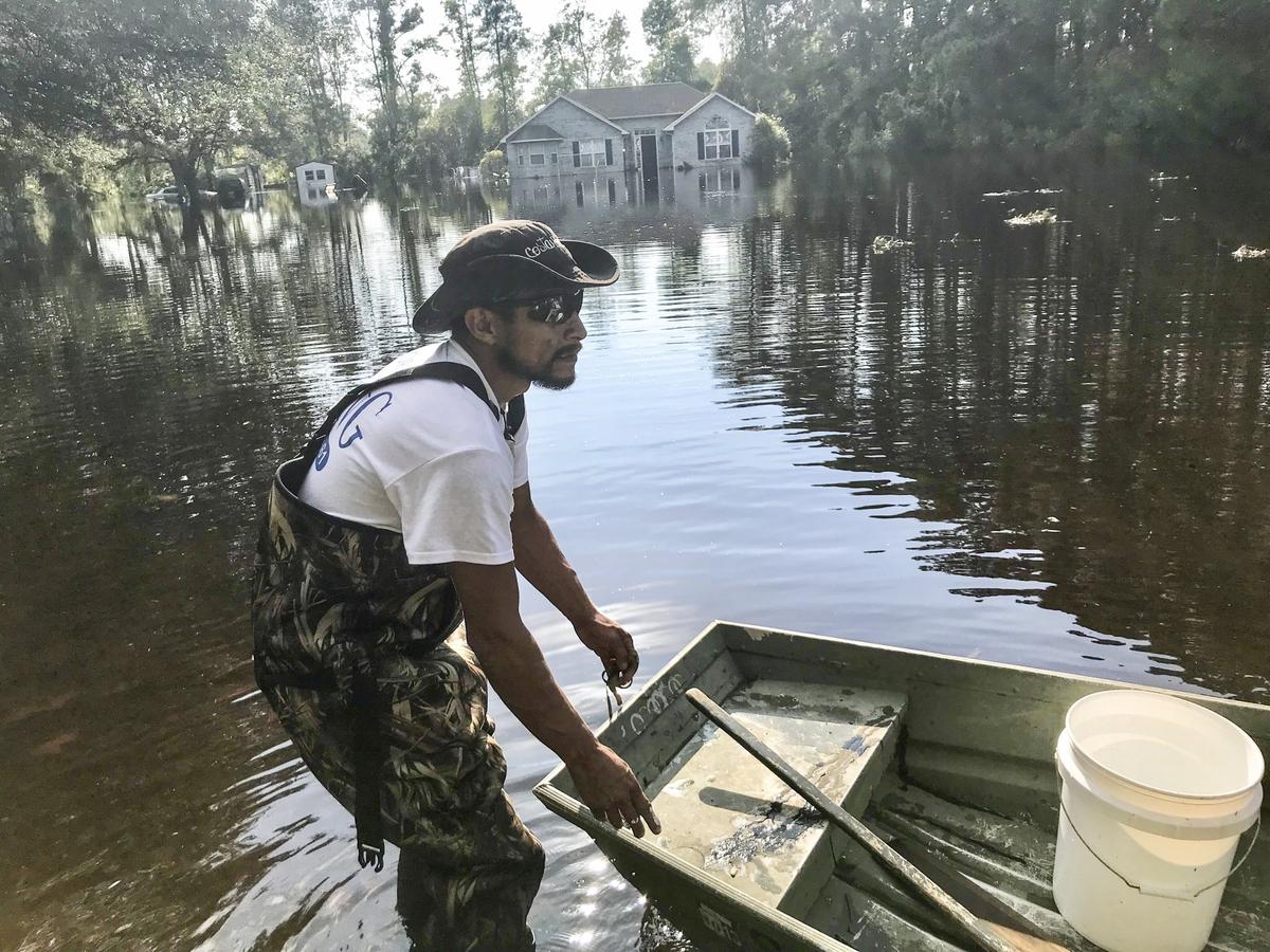 Henry Mora visits his flooded home that had never flooded in six years. “It just happened overnight, he said. It’s really really painful.” Water began flooding the small community of Longs late in the week touching some homes that did not expect to suffer the flood’s wrath. September 21, 2018.