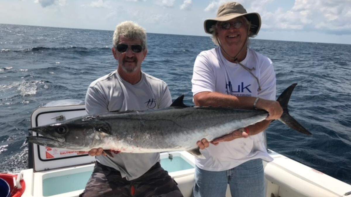 Capt. Danny Carey of CareyOn Charters (left) and Jim Eckstein of Orangeburg
show off a king mackerel approaching the 50-pound range caught on a charter
trip Tuesday.