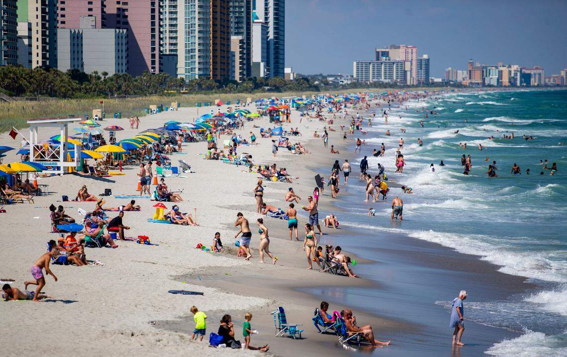People gather along the beach near Pier 14 Tuesday afternoon in Myrtle Beach. Coronavirus cases grew by 150 and two virus-related deaths were reported in Horry County Tuesday afternoon, according to state health officials.