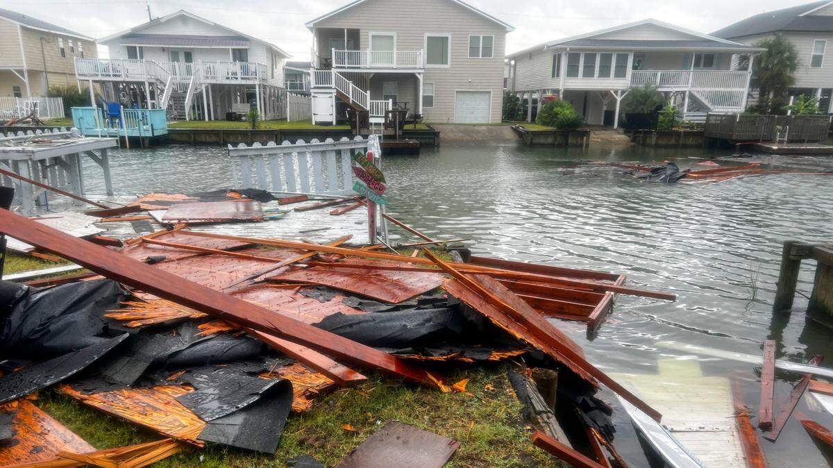 Portions of a roof lay scattered in the canals of Hog Inlet in North Myrtle Beach S.C. after a tornado damaged roofs near 56th Avenue North in North Myrtle Beach, S.C. Hurricane Idalia was downgraded to a tropical storm after hitting the gulf coast of Florida on Wednesday but brought heavy rains, coastal flooding and tornados to the South Carolina coastline. Aug. 31, 2023.