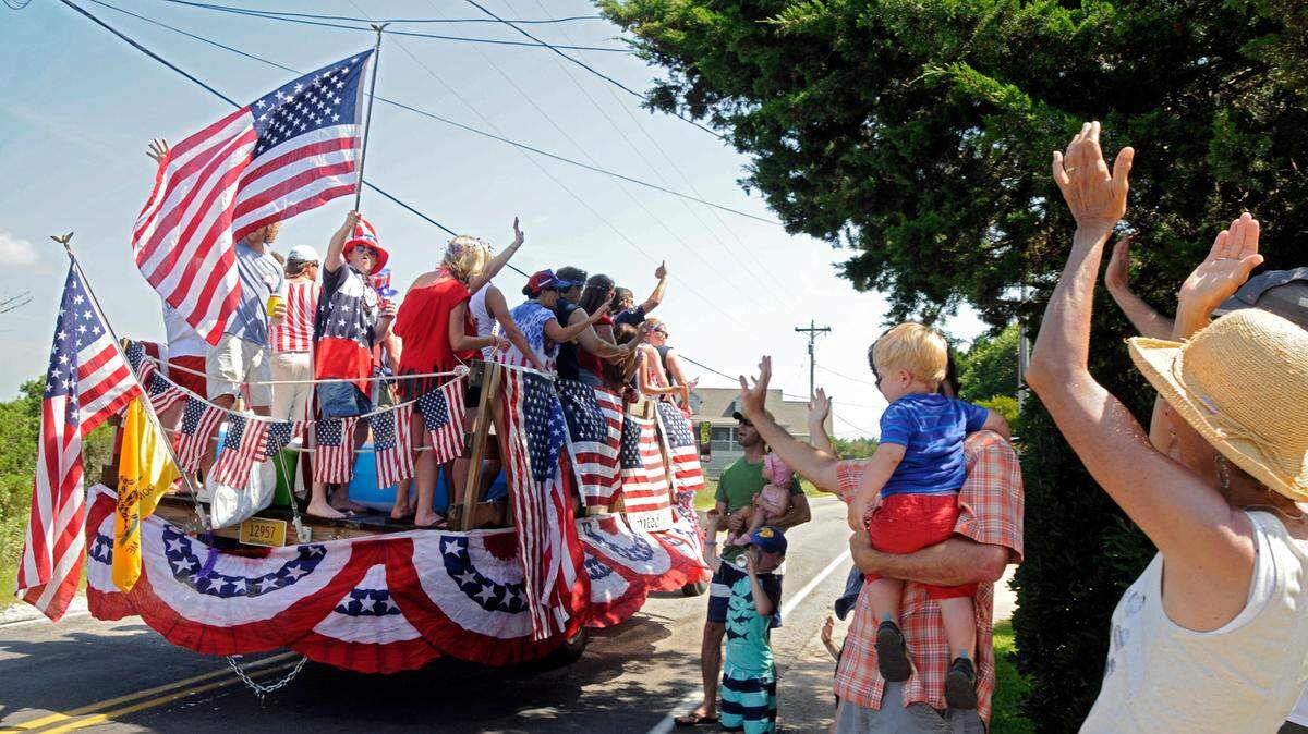 Visitors and locals paraded down Pawleys Island on homemade floats made from boats, golf carts and flatbed trucks all decorated in red, white and blue during the 48th Annual Fourth of July Parade, Friday morning. Many threw out candy, beads or other gifts to the crowds along the Island roads enjoying the fun family tradition.