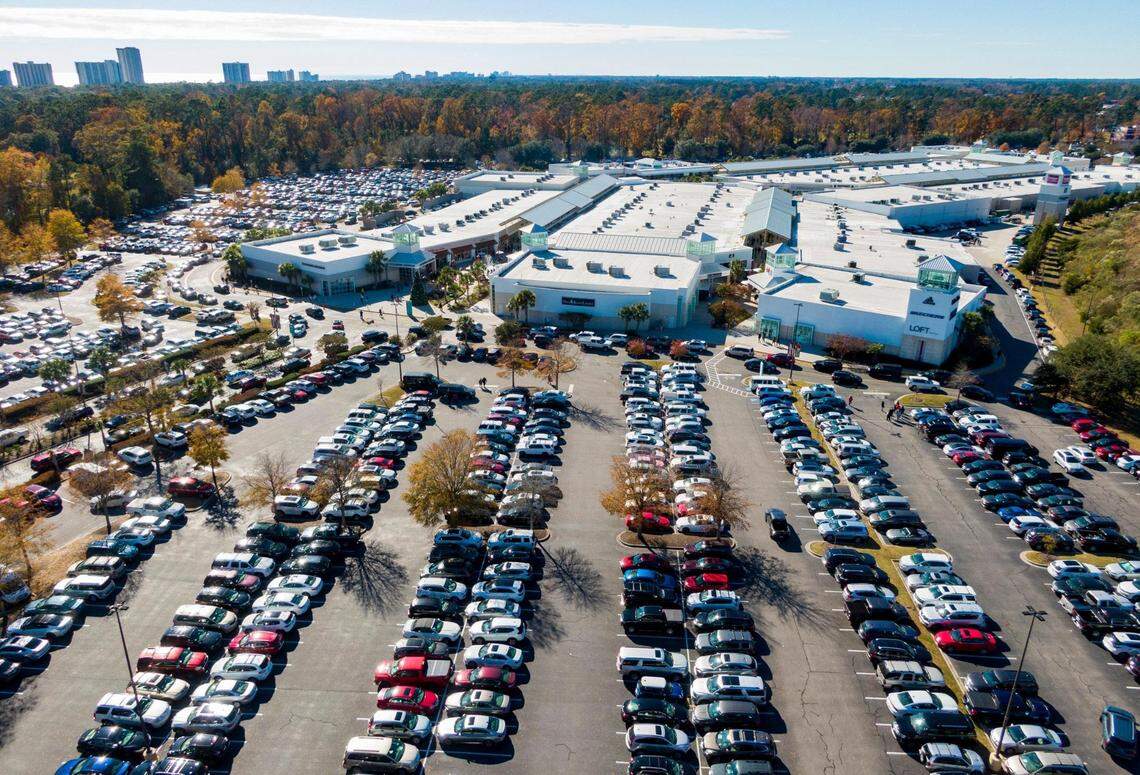 Holiday shoppers search for parking spots at Tanger Outlets in North Myrtle Beach on Black Friday after the Thanksgiving holiday.