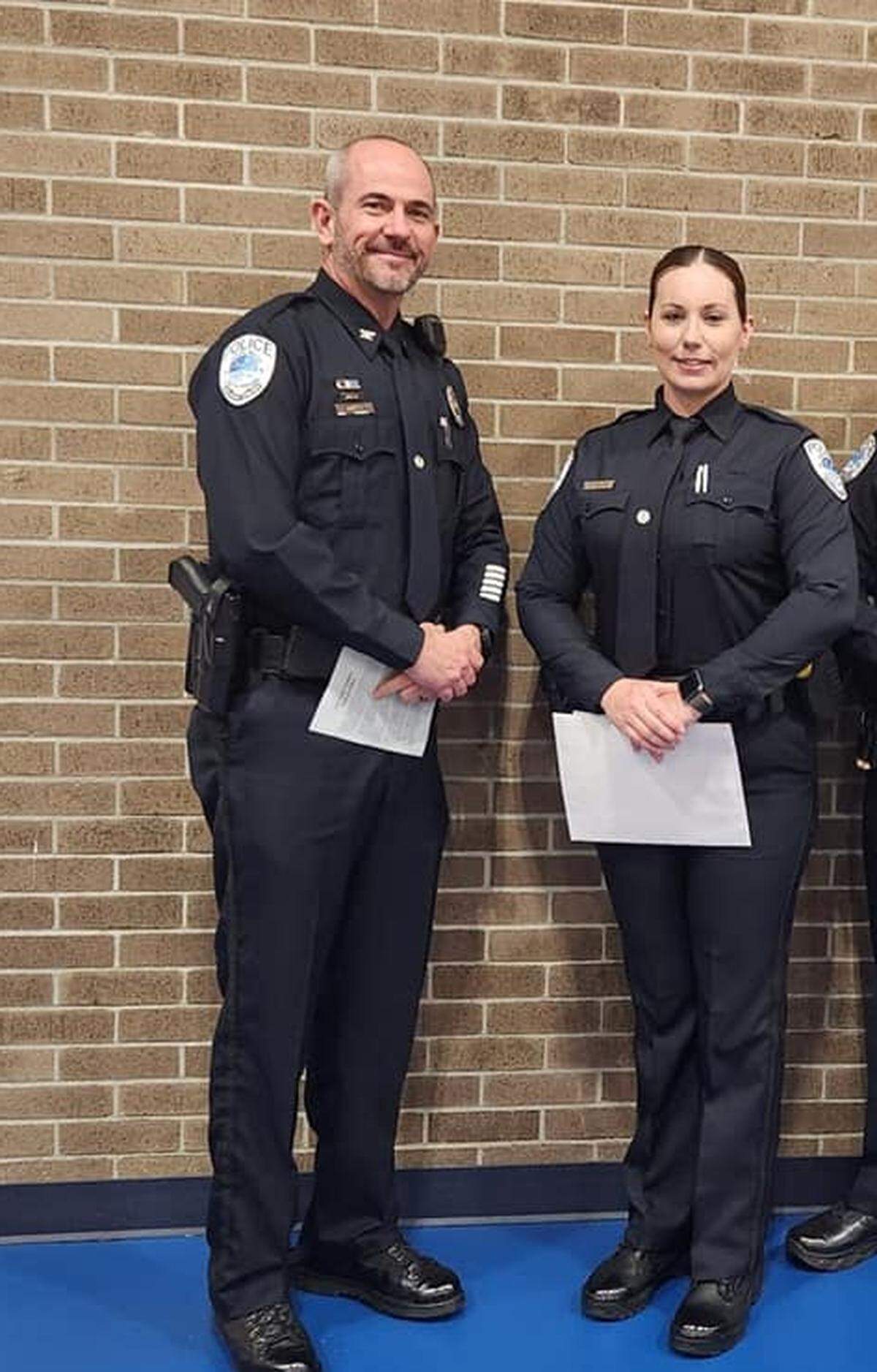 Former Surfside Beach Police Officer Samantha Mabon poses for a picture with Chief Kenneth Hofmann after graduating from the S.C. Criminal Justice Academy.