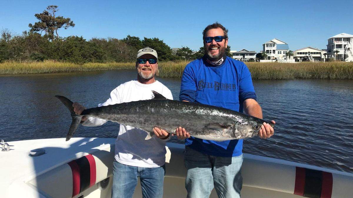 Dan Mason and Mark Hewett of Gone Again display the winning 40.45-pound king mackerel in the Fall Brawl out of Ocean Isle Fishing Center in Ocean Isle Beach, N.C., on Sunday.